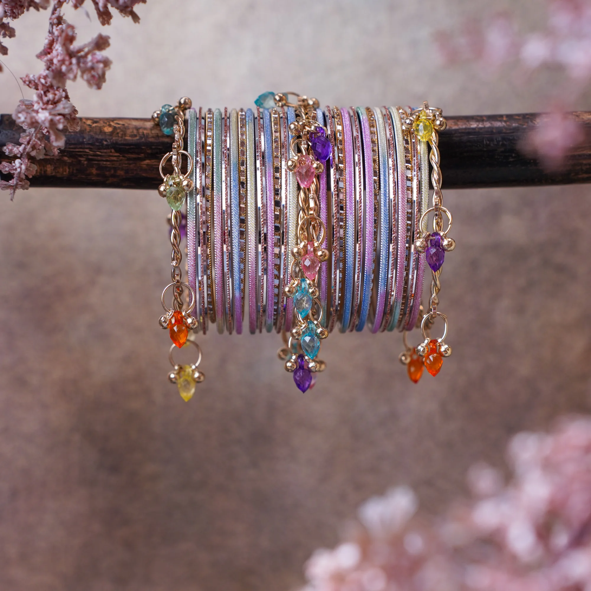 A playful multicolor pastel bangle stack with delicate charms and subtle shimmer. The summer palette of your dreams, ideal for every day wear, festive occasions, gifting and basically... everything.
Loved by people across all ages.